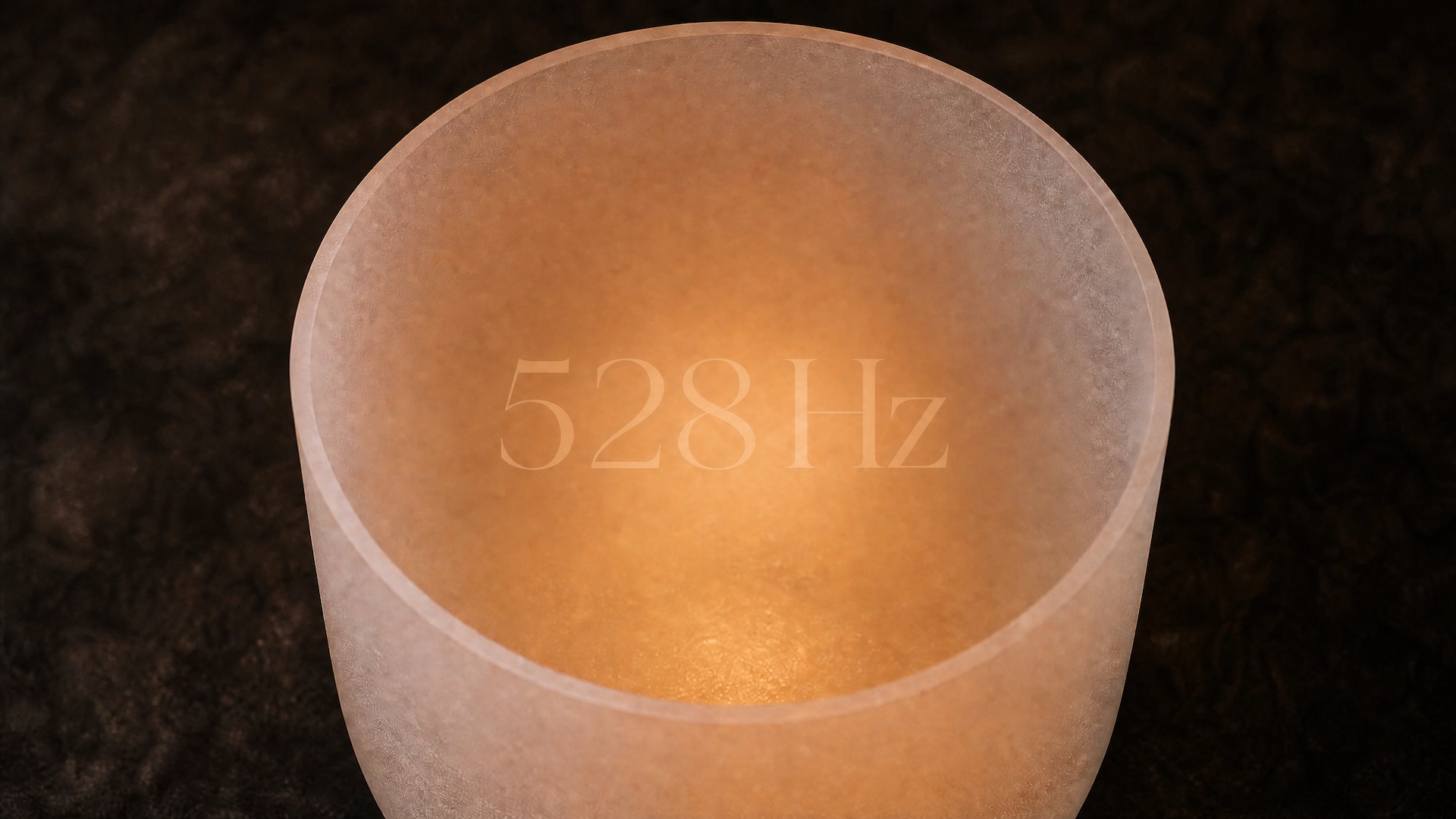 Close-up of a singing bowl with the number 528 Hz overlaid, dark atmospheric background